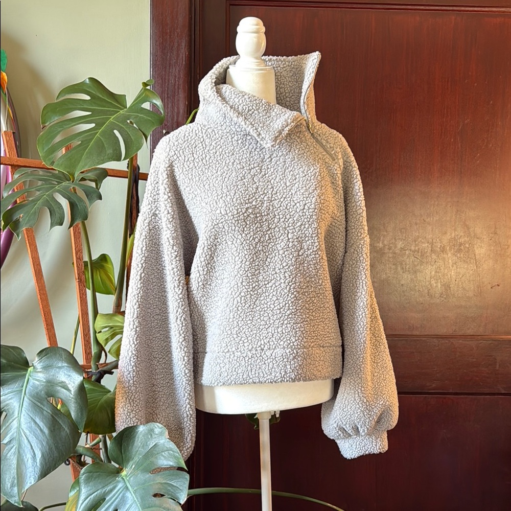 Cropped sweater with high neck side zip